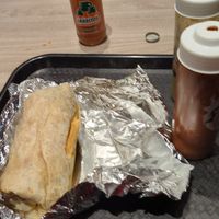 AZ burrito with hot sauces and Jarritos tamarind soda at Tacos Veganos in Phoenix