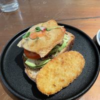 Vegan avocado toast with added sunny side up fried vegan egg and hash brown  at The Little Poet in Hobart