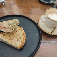 Toastie with vegan ham and vegan cheese and a soy flat white coffee at The Little Poet in Hobart