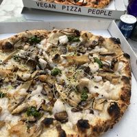 Pizza tutto mushroom (front) and pizza il bacio (back)  at Mastino Pizza in Amsterdam