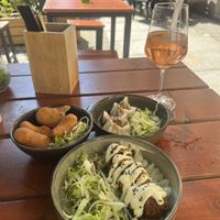 3 tapas - sushi roll, dumplings, and a fried ball.   at Ouai in Leipzig