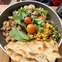 Harissa tofu scramble with garlic beans, garlic naan and all the trimmings  at Harry's Cafe & Bakery in Hepburn Springs