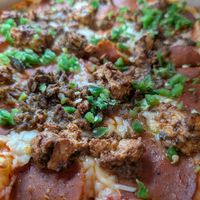 Meat the vegan mets pizza. Vegan pepperoni, chicken, sausage and jalapeno. at Two Boots - East Village in New York City