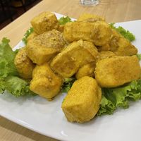 Fried tofu, $5 (plus 10% tax). Thought this would be a safe vegan dish, but I found out the hard way it’s made with egg.  at JC Vegetarian Restaurant in Phnom Penh