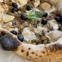 Caponata with vegan rice cheese, smoked cashew cream, eggplant, olives, courgette and parsley.   at Tozzi Forneria Moderna in Lisbon