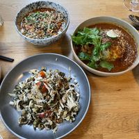 Burmese fermented tea leaf sticky rice salad / charred flat cabbage / chengdu street tofu  at alter in East London