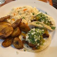 Vegan tacos al pastor with rice and fried plantains  at Salsa A La Salsa in Minneapolis