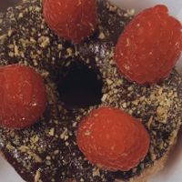 Raspberry- Pistachio- Cross😍  at Royal Donuts in Krefeld