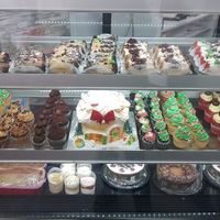 Selection of individual pastries and family size Bûches de Noël at La Mie Bio in Pointe-claire