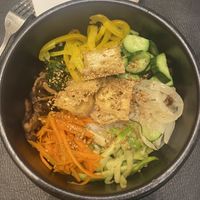 Vegan Bibim Bap, served with tofu instead of egg and meat. With a chilli sauce.   at bibim in Amman