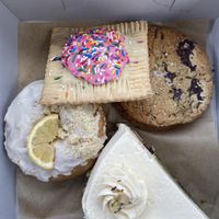 Raspberry poptart, sea salt chocolate chip cookie, lemon brioche donut, and lemon cake.   at Just What I Kneaded in Los Angeles
