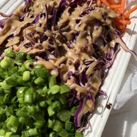 Broadway bowl with tofu, rice, cabbage, carrots with peanut ginger sauce at Native Bowl - Food Cart in Portland