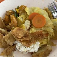 Curry veg + lemon chicken & taukee. Cost $3.50😂   at Su Yuan Vegetarian 素缘 - Bedok in East Singapore