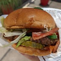 Burger with bacon. at Project Pollo in Austin