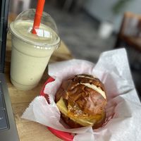 Banana Matcha Smoothie and Pretzel Bun Just Egg with Sausage sandwich   at Sinfull Bakery in Houston