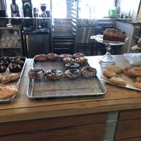 Doughnuts, sliced loafs, muffins and more pastries. Still no labels   at Le Petit Monstre in Brooklyn