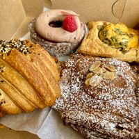 Raspberry cronut, cheese danish, almond croissant, and savory croissant at Le Petit Monstre in Brooklyn