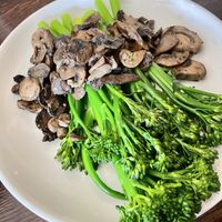 Steamed broccolini and sautéed mushrooms  at Diamondback Grill in Sonora