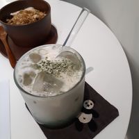 Mugwort latte on a cute panda coaster at LouLou Vegan in Jeju