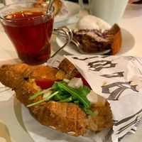 Vegan croissant with vegan cheese & glögi. at Café Adjutant in Helsinki