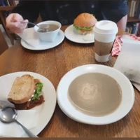 Creamy mushroom soup, parsnip sandwich (bottom left) and southern fried tofu Sandwich (top) at Thyme Cafe and Bookstore in Winnipeg