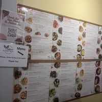 menu on wall  at Vegan Deadly Sins in Sacramento