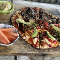 Half half pizza, mushrooms and I forgot the other one  at Layla Restaurant Plants & Mushrooms in Puerto Morelos