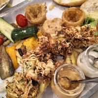 The veggie platter - grilled veg, falafel, friend zucchini, onion rings, chips, bread, salad, and sauces at Mix in Nha Trang