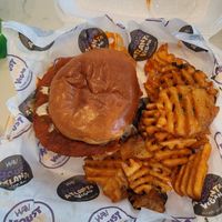 Already took a few bites out of the Magic City Chicken Sandwich at Houstatlantavegan in Houston