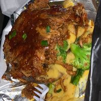 BBQ ribs over a baked potato with broccoli  at Vegan Heat in Duncanville