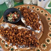 Molletes con chorizo y queso  at Veggie Veggie in Puerto Morelos