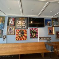 All of their paintings for sale in the coffee shop! at Nine Lives Cat Café in Indianapolis