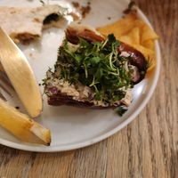 Half of a Lobster roll and remains of a taco in the back at Aunts et Uncles in Brooklyn