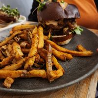 Smash burger with fries at Aunts et Uncles in Brooklyn
