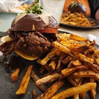 Chicken sandwich with fries at Aunts et Uncles in Brooklyn