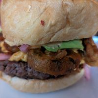 Jalapeno Bomb Burger - impossible burger, fried jalapeno, avocado, pickled onion, chipotle aioli, vegan cheese at Galaxy Hut in Arlington