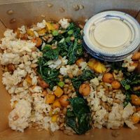 Roasted Kale + Squash Bowl. brown rice, butternut squash, roasted kale, chili spiced chickpeas, sunflower seeds, maple tahini  at Buckeye Chocolate Café Bainbridge in Auburn