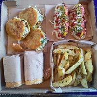Combo: papas gajo, baguette de milanesa, jochos con salchicha de seitan, gorditas de chicharrón  at Coral Restaurante in Cozumel