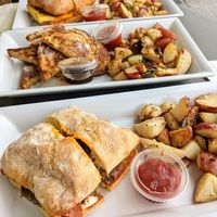 Bleu bird burger, french toast, Farmer John breakfast sandwich at Brunch Bird in Austin