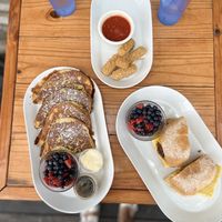 Classic French Toast, Mozzarella sticks and the Farmer John Breakfast Sandwich— all delicious!  at Brunch Bird in Austin