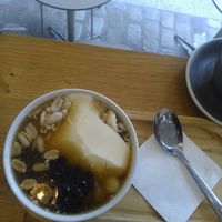 fleur de tofu with silken tofu, cashews, adzuki beans, and tapioca pearls (served warm with ginger syrup) at Graines du Jour in Paris