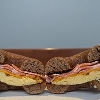 vegan bacon, cheese, and egg on a pumpernickel bagel at Spielman Bagels and Coffee Roasters in Portland