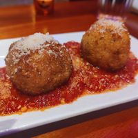 Fried mac and cheese balls with marinara sauce and vegan parmesan at Monster Vegan in Philadelphia