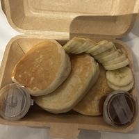 Delicious pancakes with salted caramel sauce and banana  at Carrots The Vegan Kitchen in Bangkok