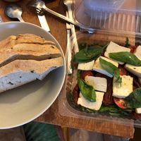„Tofu Caprese“ – Marinated tofu with basil; dried, and cherry tomatoes, served on rucola. There was also half a loaf of warm, fluffy olive bread. 5€ (04.01.2021) at Rusticana in Berlin