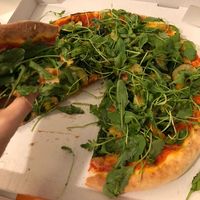 Pizza Landwirt (a lot of vegan cheese topped with zucchini, green beans and much argula) at Rusticana in Berlin