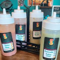 All sauces are vegan, mild to extra hot. at Comālli Taqueria in Reading