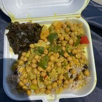  Chickpea curry with side of rice and collards   at Red Stripes Caribbean Cuisine & Lounge in Hilton Head Island