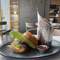 Buttermilk chicken sandwich with avocados, romaine lettuce in a brioche bun   at Willow Vegan Bistro in New York City