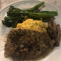 Chicken Marsala with oyster mushroom, polenta, and broccoli rabe   at Willow Vegan Bistro in New York City